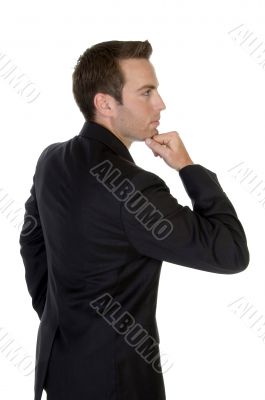 businessman with chin resting on hand
