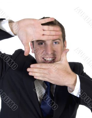 man making frame shape with fingers