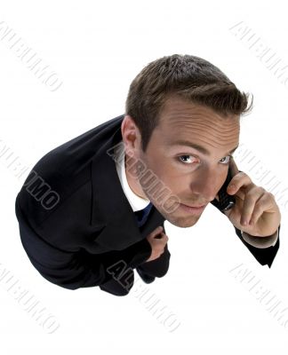 businessman busy on phone call and looking upwards