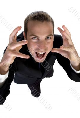 young businessman shouting and looking upside