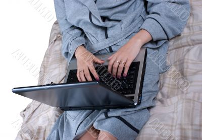 The girl in a dressing gown with the laptop