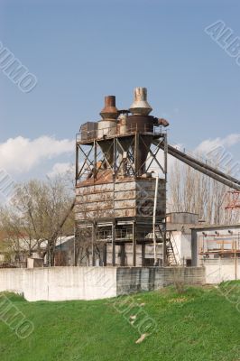 Old factory on a green hill