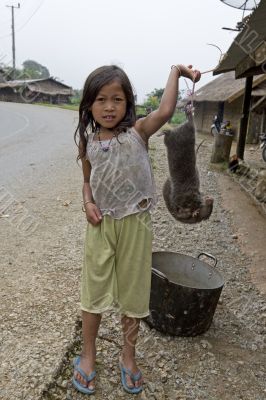 child sell mole for a meal, Laos