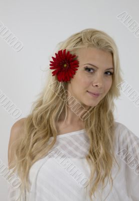 sensual lady with red flower in hair