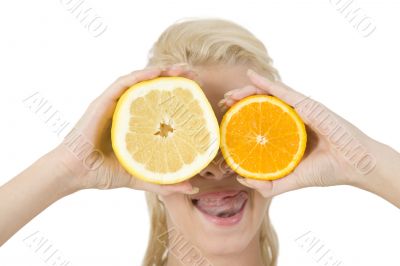 pretty lady covering her eyes with slice of fruits