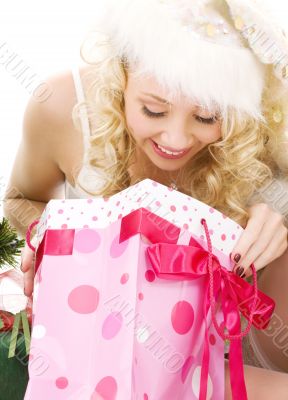 lovely santa helper girl with christmas gifts