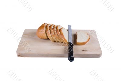 The cut bread on a chopping board.