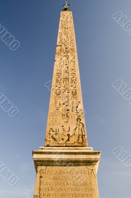 Egyptian obelisk on blue