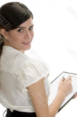 smiling lady with pen and paper in writing pad