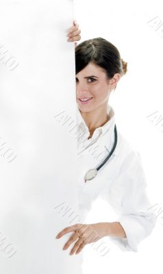 doctor standing with placard