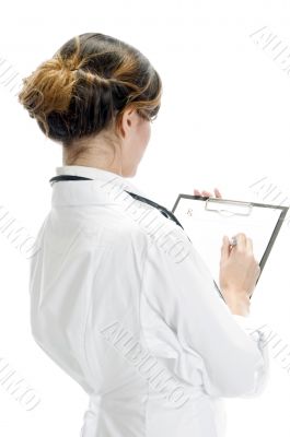 doctor writing on paper