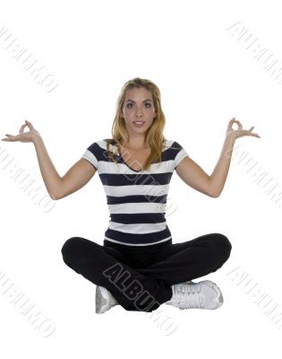 lady performing yoga sitting in lotus pose