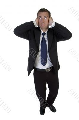 full pose of businessman putting hands on his ears