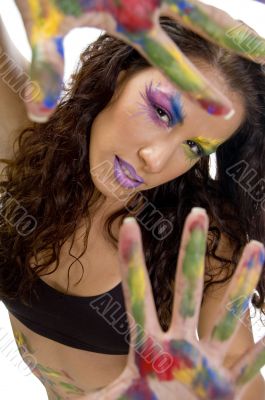 female model showing colorful hands