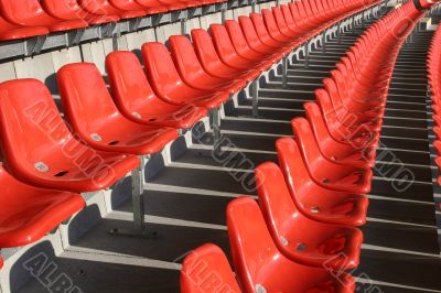 Red seats in a Sports Venue without people Red seats in a Sports Venue without people