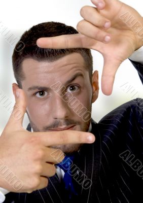 young businessman making a finger frame