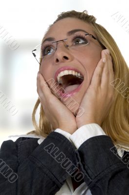 shocked female with  hands on face