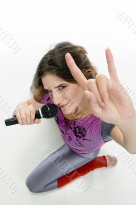 female with karaoke showing hand gesture