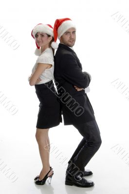smiling couple posing with santa cap