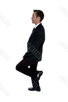 young businessman benting one leg