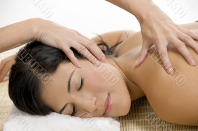 young woman receiving back massage