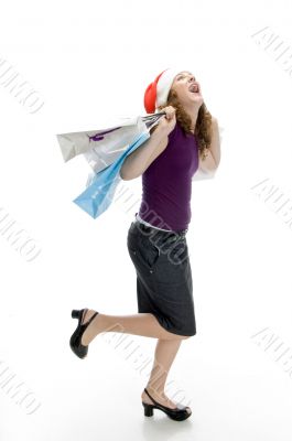cheerful lady holding carry bags