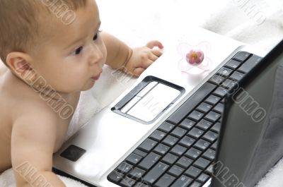 cute baby playing with laptop