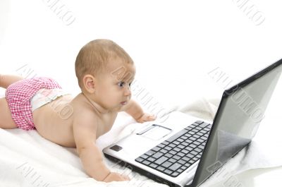 cute baby playing with laptop