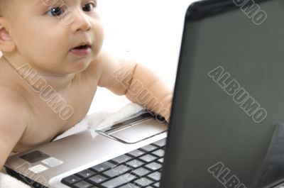 young child interested with laptop
