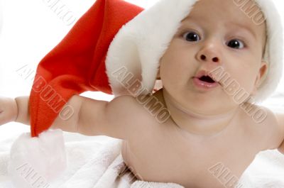 young cute baby boy with red santa cap