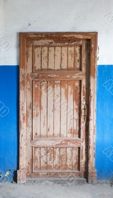 The closed old decayed door