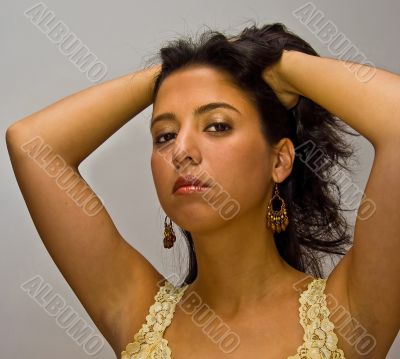Latina with hands in hair