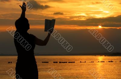 female praying with bible female praying with bible