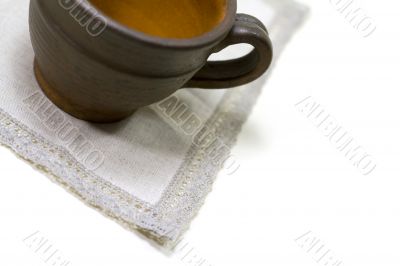 empty coffee cup and linen napkin