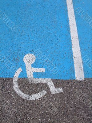Logo on asphalt for disabled persons