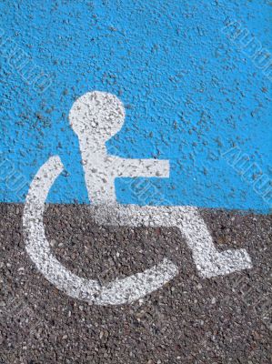 Logo on asphalt for disabled persons