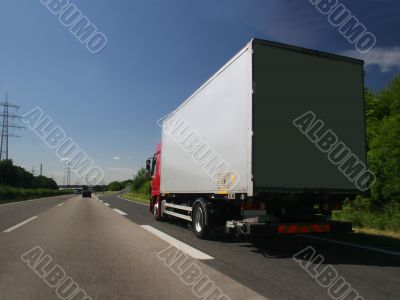 Truck on the exit lane of a highway