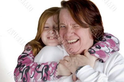 grandmother and granddaughter cuddling eachother