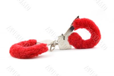 closed red handcuffs isolated on white background
