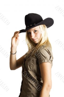 young rodeo cowgirl  holding cowboy hat