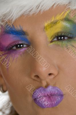 close up of female model with colorful makeup