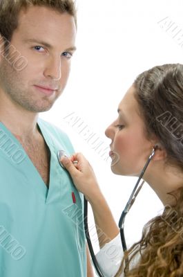 doctor examining the patient with stethoscope