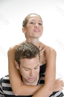 young man giving piggyback to woman