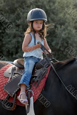baby riding girl