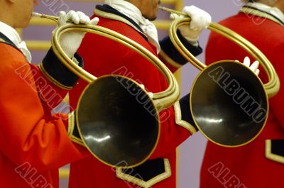 details of musicians playing on hunting horns