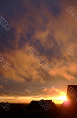 stratus clouds with orange reflection on sunset