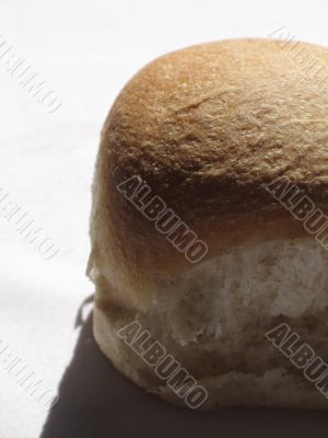 small bread bun casting shadow