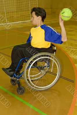 Handicapped person sport handball in the wheelchair