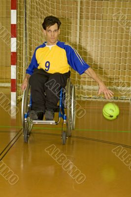 Handicapped person sport handball in the wheelchair