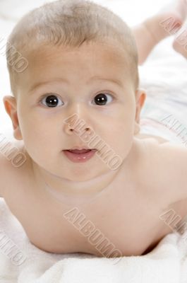 happy child lying and looking at camera